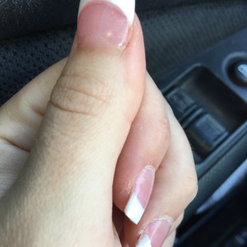 Happy Spa Nails - Spot of superglue on right side of thumb that she used to cover the hole she filed in my nail so I wouldn't bleed out. - Nail Salons Near Me - Angels Camp, California