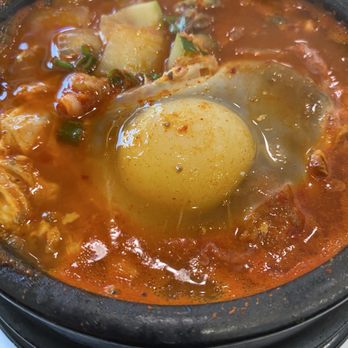 Masito - Spicy tofu soup with beef and seafood; you add the egg when ot comes to the table. - Korean Near Me - Anaheim, California