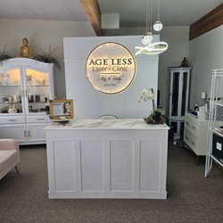 Age Less Laser + Clinic - Picture of front desk with lit up sign behind
