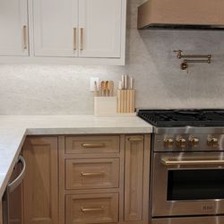 Marquez's Custom Cabinets - White Oak inset cabinetry with White uppers.