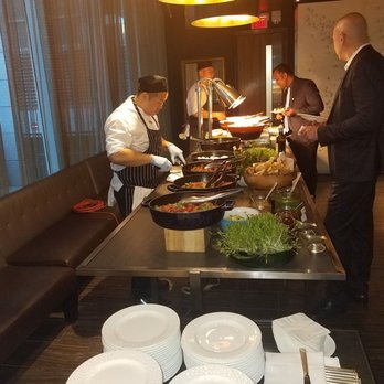 Ritz Bar - a group of chefs preparing food - International Near Me - Toronto, Ontario Ritz Bar - a group of chefs preparing food - International Near Me - Toronto, Ontario