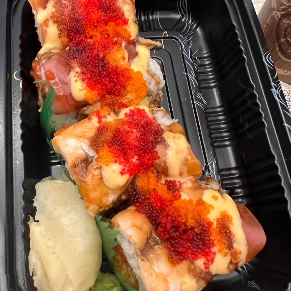 three pieces of sushi in a plastic container three pieces of sushi in a plastic container