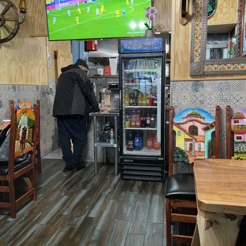 El Mexicano Restaurante & Cafe - a man standing in front of a television - Mexican Near Me - Brooklyn, New York El Mexicano Restaurante & Cafe - a man standing in front of a television - Mexican Near Me - Brooklyn, New York