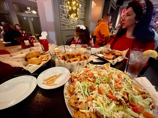 Photo of MaGerk's Pub & Grill - Fort Washington, PA, US. Cheese steak nachos  onion rings and wings