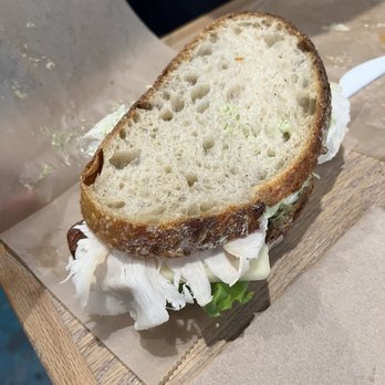 Born & Bread Bakehouse - Sandwich not cut in half = problematic to eat. Plastic knife isn't sharp enough to cut through the crust on this bread easily. - Bakeries Near Me - Lakeland, Florida