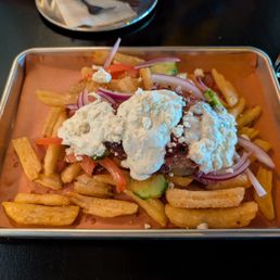 Meat stick. Tzatziki. Crisp fries. Onions, tomatoes, cucumbers, feta. Meat stick. Tzatziki. Crisp fries. Onions, tomatoes, cucumbers, feta.