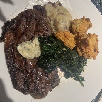 Foodcraft - Ribeye with rustic mashed potatoes, sauteed spinach and an addition of fried oysters. - Seafood Near Me - Gulf Shores, Alabama