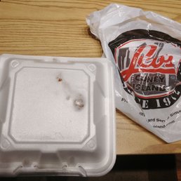 a plastic container and a bag of chips