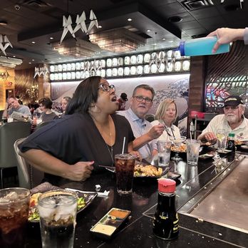 Masa Sake Grill - Perfect aim! Sake shooting into the birthday girl's mouth. - Sushi Bars Near Me - Indianapolis, Indiana Masa Sake Grill - Perfect aim! Sake shooting into the birthday girl's mouth. - Sushi Bars Near Me - Indianapolis, Indiana