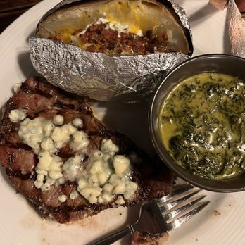 Cactus Cove Inn & Suites - New York strip with creamed spinach and loaded baked potato - Hotels Near Me - Amarillo, Texas Cactus Cove Inn & Suites - New York strip with creamed spinach and loaded baked potato - Hotels Near Me - Amarillo, Texas