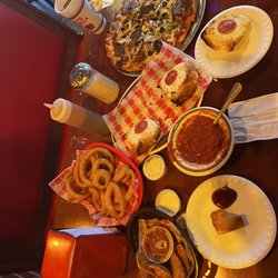 Tony's Pizza - Raviolis, onion rings, Italian cheese bread, 12" super deluxe