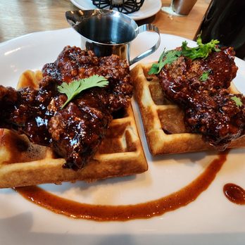 Tupelo Honey Southern Kitchen & Bar - Sriracha chicken and waffles. Just the right amount of sweet and spicy. - Southern Near Me - Des Moines, Iowa Tupelo Honey Southern Kitchen & Bar - Sriracha chicken and waffles. Just the right amount of sweet and spicy. - Southern Near Me - Des Moines, Iowa