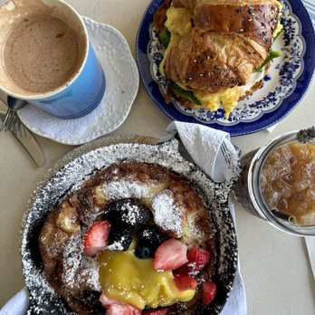 Clayton's Bakery & Bistro - Dutch baby pancake. And Egg, Spinach, Tomato, Parmesan on Everything Croissant - Bakeries Near Me - Coronado, California Clayton's Bakery & Bistro - Dutch baby pancake. And Egg, Spinach, Tomato, Parmesan on Everything Croissant - Bakeries Near Me - Coronado, California
