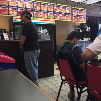 Naco’s Tacos - two men sitting at a table - Mexican Near Me - Colorado Springs, Colorado