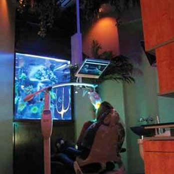 Exceptional Dentistry - Patient watching TV while getting Zoom Teeth Whitening - General Dentistry Near Me - Gilbert, Arizona