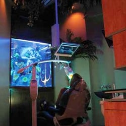 Exceptional Dentistry - Patient watching TV while getting Zoom Teeth Whitening
