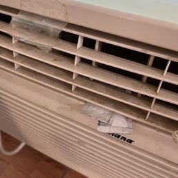 Nasty AC with ketchup packets stuffed inside.