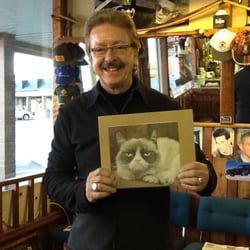 Vince Hair Stylist & Barber Shop - The barber, with picture of his cat (when having a good day!!)