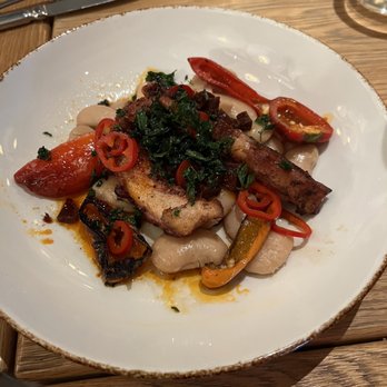 Small Batch - Grilled octopus with chorizo, hot and sweet peppers, butter beans and kale crisps on top - New American Near Me - Garden City, New York Small Batch - Grilled octopus with chorizo, hot and sweet peppers, butter beans and kale crisps on top - New American Near Me - Garden City, New York