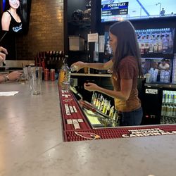 Sidelines Tavern & Grill - Katie mixing drinks and having fun.