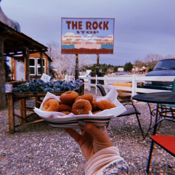 Rock Stop - a person holding a plate of doughnuts - Coffee & Tea Near Me - Orderville, Utah