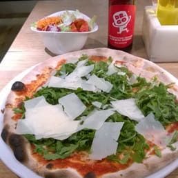 Rucola pizza, side salad and soda called Dr. Go (caffeinated)