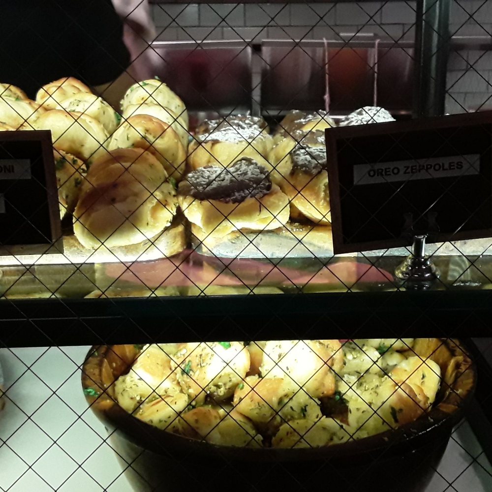 Mini pepperoni rolls, oreo zeppole, and garlic knots on bottom Mini pepperoni rolls, oreo zeppole, and garlic knots on bottom