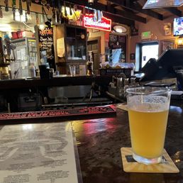 a pint of beer on the bar