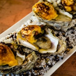 Saltwater Grill - Oysters Grandfellar with local Conecuh Sausage is one of our great shareable appetizers.