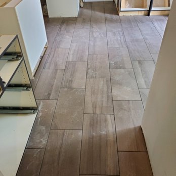 Weisz Tile & Stone - 1/3 stagger on floor. Keeping the line true. - General Contractors Near Me