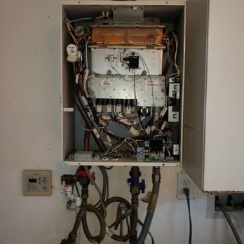 Liberty Plumbing - Remove and replace old leaking tankless water heater - Plumbing Near Me Liberty Plumbing - Remove and replace old leaking tankless water heater - Plumbing Near Me