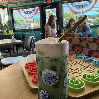 Novo Cafe - Very Berry Matcha has layers of raspberry, strawberry, Matcha, and milk with vanilla cold foam.  Deliciously sweet! - Cafes Near Me - New Kensington, Pennsylvania