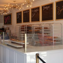 a bakery counter with a variety of pastries a bakery counter with a variety of pastries