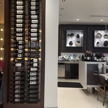 M Brothers at Mayo - Wine wall and bar area - French Near Me - Jacksonville, Florida