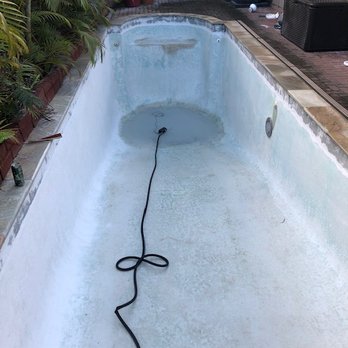 Natural Salt Pools - Here is my pool after they drained it and started grinding. Yes, rough on the feet and butt! - Pool & Hot Tub Service Near Me - Kailua, Hawaii Natural Salt Pools - Here is my pool after they drained it and started grinding. Yes, rough on the feet and butt! - Pool & Hot Tub Service Near Me - Kailua, Hawaii