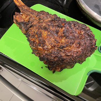 The Butcher Block - Prime Tomahawk Steak covered in a layer of mustard and a layer of Montreal Steak Spice. - Butcher Near Me - Henderson, Nevada The Butcher Block - Prime Tomahawk Steak covered in a layer of mustard and a layer of Montreal Steak Spice. - Butcher Near Me - Henderson, Nevada