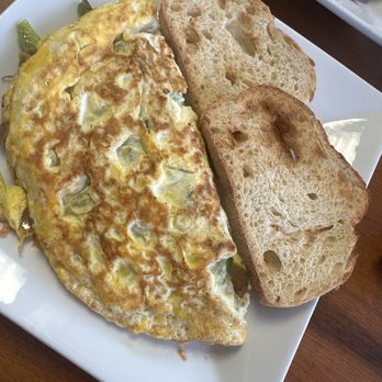 Pili's Cafe - Omelet and side of toast - Coffee & Tea Near Me - Hallandale Beach, Florida Pili's Cafe - Omelet and side of toast - Coffee & Tea Near Me - Hallandale Beach, Florida