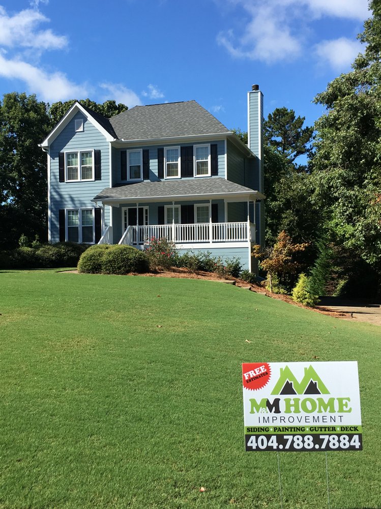 Slide of M&M Home Exteriors