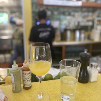 Estia's Little Kitchen - Bar section view, mimosa, their homemade hot sauces ! - Breakfast & Brunch Near Me - Sag Harbor, New York Estia's Little Kitchen - Bar section view, mimosa, their homemade hot sauces ! - Breakfast & Brunch Near Me - Sag Harbor, New York