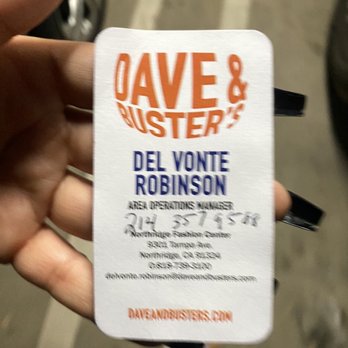 Dave & Buster's Northridge - a hand holding a business card - Arcades Near Me - Northridge, California Dave & Buster's Northridge - a hand holding a business card - Arcades Near Me - Northridge, California