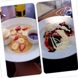 Pancakes with banana and strawberry on the left. Eggs Benedict with an extra side of mushrooms on the right. Pancakes with banana and strawberry on the left. Eggs Benedict with an extra side of mushrooms on the right.