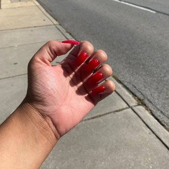 Glow Nails and Spa - "Big apple red" opi gel color square shaped with rhinestone on middle finger - Nail Salons Near Me - Ardmore, Pennsylvania Glow Nails and Spa - "Big apple red" opi gel color square shaped with rhinestone on middle finger - Nail Salons Near Me - Ardmore, Pennsylvania