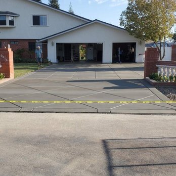 A &E Landscaping - a driveway with yellow tape - Artificial Turf Near Me A &E Landscaping - a driveway with yellow tape - Artificial Turf Near Me