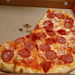 Pizza Pizza - Partially eaten (sorry) large pepperoni pizza. Walk in special $7.99. They give you a lot of pepperoni!