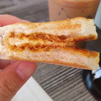 Ipoh Kopitiam - Toast with Kaya and butter. Plus Malaysia milk tea in the background. - Malaysian Near Me - Alhambra, California