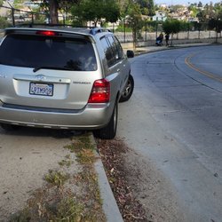 Silver Lake Reservoir - At 5:42 pm May 4, 2024. This vehicle was seen nearly striking folks walking on the sidewalk.