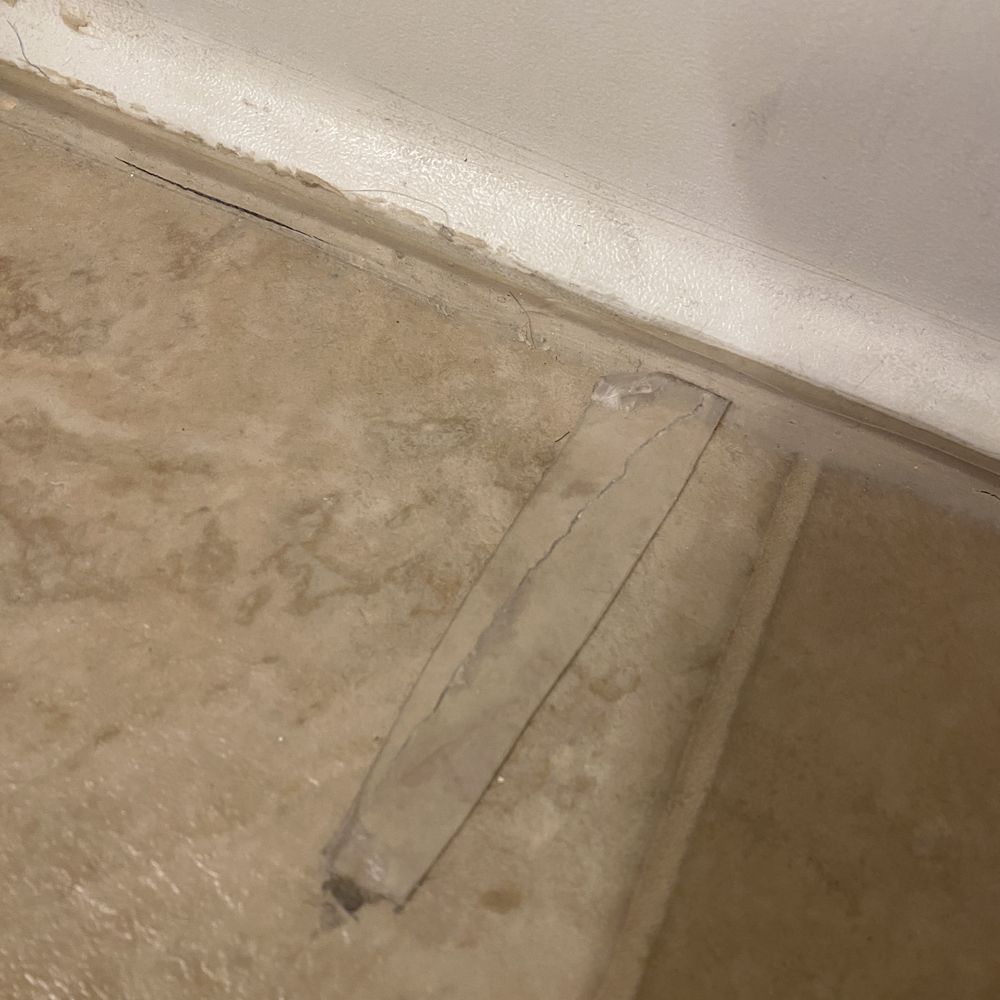 Lilly Enterprises - How they "fix" floors. With tape. - Property Management Near Me - Gardena, California