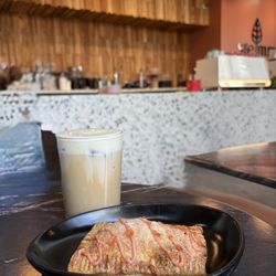 Stemma Craft Coffee - El Guerito with pineapple cold foam and a guava cream cheese pop tart.