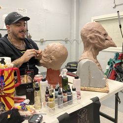 Makeup artist at work creating original design