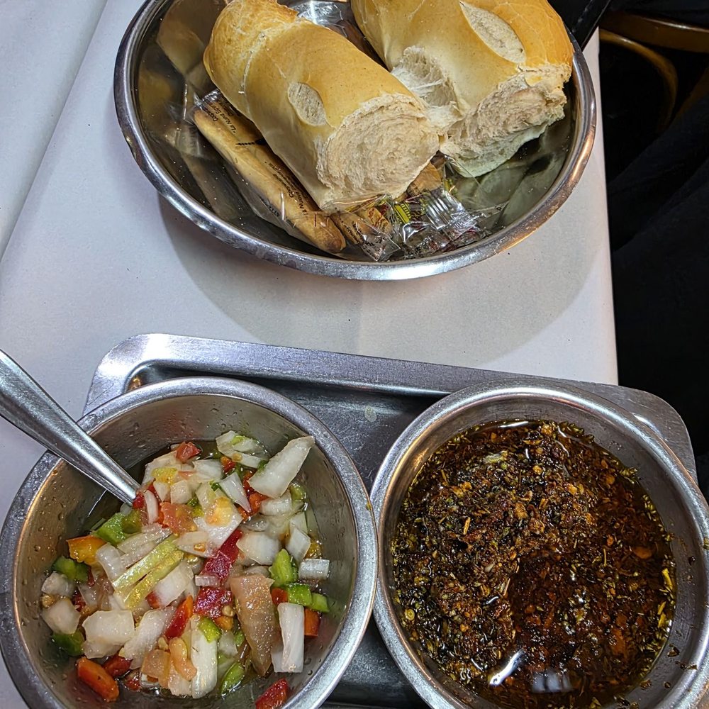 Parrilla Peña - Complimentary chimichurri and salsa to go with the steak. - Argentine Near Me - Buenos Aires, C Parrilla Peña - Complimentary chimichurri and salsa to go with the steak. - Argentine Near Me - Buenos Aires, C